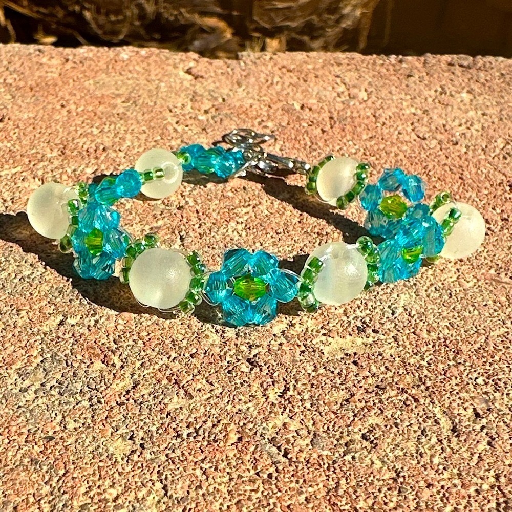 Bright Blue Flower Bracelet with Reflective White Beads and Silver Accents